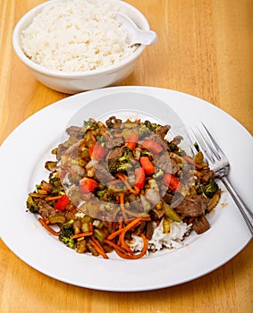 Plate of Beef Stir-fry and Bowl of Rice
