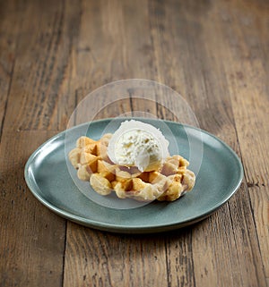 plate of belgian waffle with vanilla ice cream