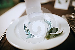 Plate with boarding card for wedding guests. Elegant table