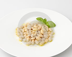 Plate of boiled beans with olive oil