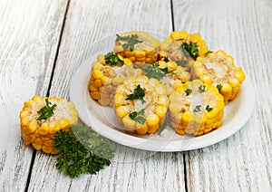 Plate with boiled corn on the cob