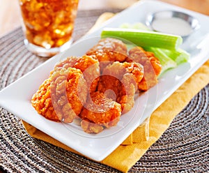 Plate of boneless buffalo flavored chicken wings