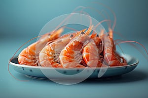 A plate of Botan shrimp on a blue table, delicious seafood recipe