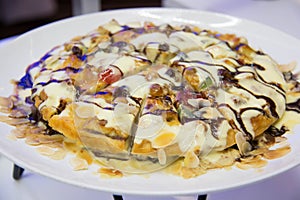 Plate of bread pudding and vanilla sauce