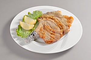 Plate with breaded cutlet Milanese