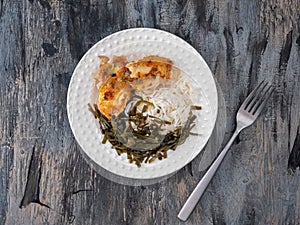 Plate with breakfast with rice, fish and seaweed