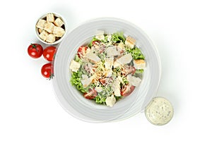 Plate with Caesar salad isolated on white background