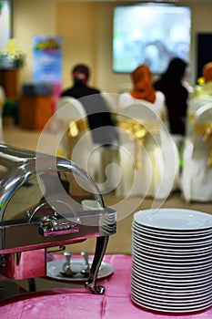 Plate and chafing dish at buffet