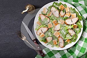 Plate of chicken caesar salad, top view