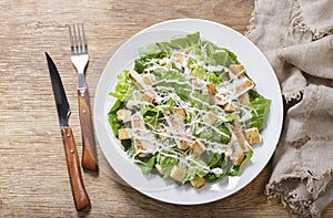Plate of chicken caesar salad , top view
