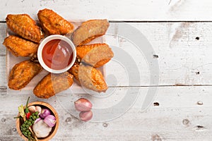 plate of chicken wings on wood