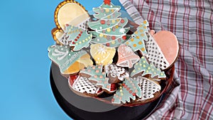 A plate of Christmas gingerbread rotates on the table.