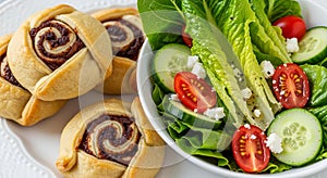 A plate with cinnamon rolls featuring swirling patterns of dough and filling,