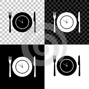 Plate with clock, fork and knife icon isolated on black, white and transparent background. Lunch time. Eating, nutrition