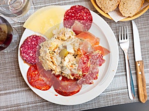 Plate with coldcuts and russain salad, Spanish entremets