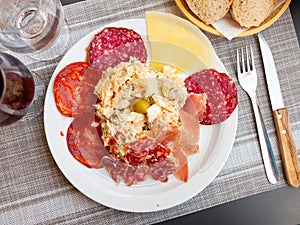 Plate with coldcuts and russain salad, Spanish entremets