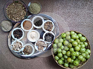 A plate containing ayurvedic medicinal dry herbs, collected for making medicinal formulation. Martynia annua, terminalia chebula,
