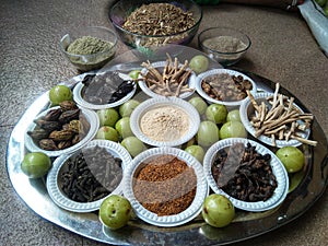 A plate containing ayurvedic medicinal dry herbs, collected for making medicinal formulation. Martynia annua, terminalia chebula,