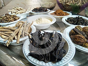 A plate containing ayurvedic medicinal dry herbs, collected for making medicinal formulation. Martynia annua, terminalia chebula,