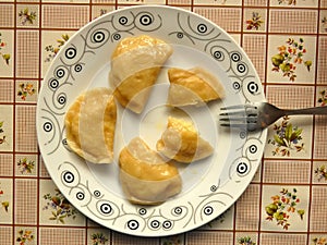 Plate of Cooked Pierogi On Table