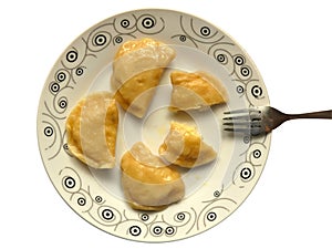 Plate of Cooked Pierogi On Table