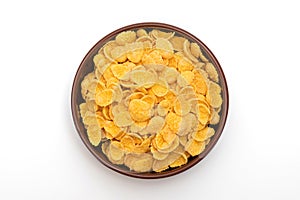 A plate of corn flakes in a plate on a white background