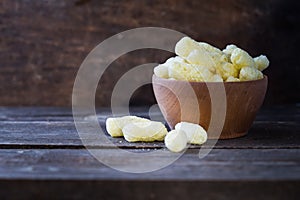 Plate with corn sticks on rustic wooden table