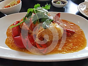 A plate of crabmeat with chilli sauce