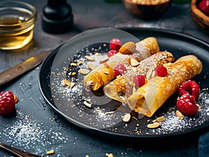 A plate of crepes with raspberries and almonds