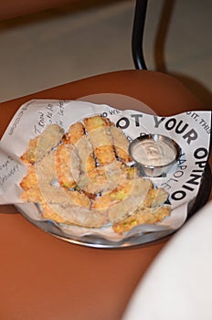 Plate of croquets on the chair, salt melts on your lips