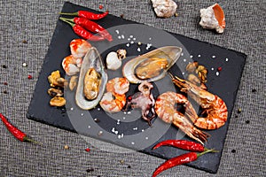 Plate of crustacean seafood with mussels, hrimps, oysters