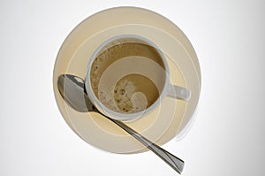 Plate and cup of coffee with spoon