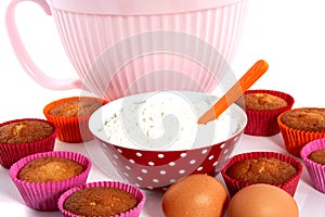 A plate with cupcakes and materials