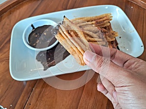 a plate of curros plus chocolate