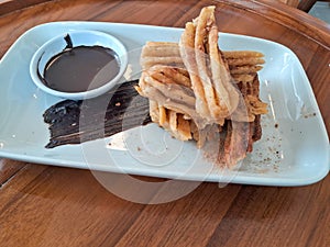 a plate of curros plus chocolate