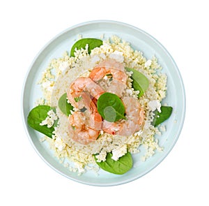 Plate of delicious couscous with shrimps and spinach isolated on white, top view