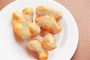 A plate of delicious deep fried dough stick