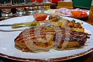 Plate with delicious hot food at the brasserie