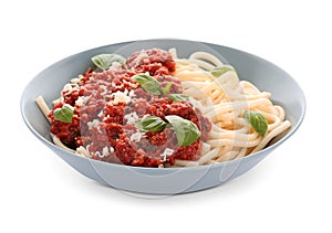 Plate with delicious pasta bolognese on white background