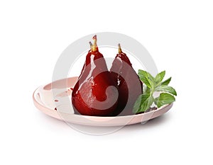 Plate with delicious poached pears in red wine on white background