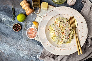 A plate of delicious shrimp alfredo with garlic and cream sauce over pasta. banner, menu, recipe place for text, top view