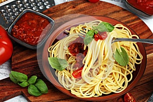 Plate of delicious spaghetti Bolognaise or Bolognese with savory minced beef and tomato sauce garnished with parmesan