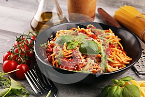 Plate of delicious spaghetti Bolognaise or Bolognese with savory minced beef and tomato sauce garnished with parmesan