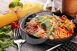 Plate of delicious spaghetti Bolognaise or Bolognese with savory minced beef and tomato sauce garnished with parmesan