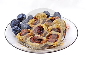 A plate with delicious sweet plum dumplings