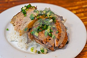 Plate of delicious Vietnam flavored grilled pork chop white rice