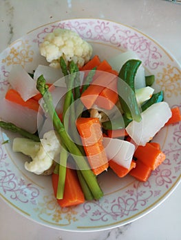 Plate of different boiled vegetable