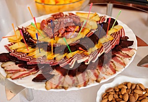 Plate with different kinds of sausages on the holaday table