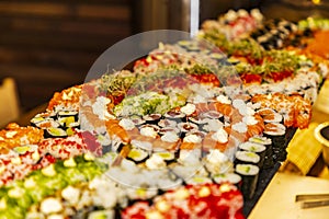 Plate with different types of sushi at a party
