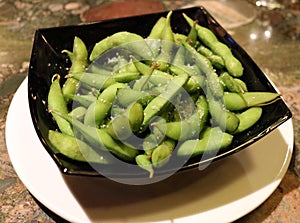 Plate of edamame at Japanese sushi restaurant